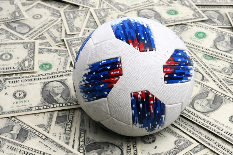 A Football on Dollar Bills